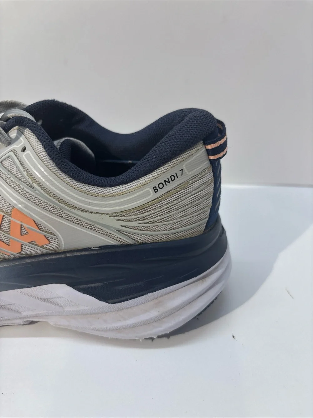 Hoka women’s size 7 gray/peach Bindi 7 style #110531 LRBI in fair condition.